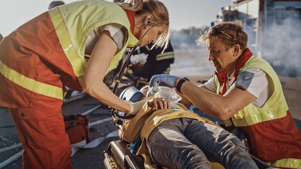 Paramedics Giving Oxygen To An Injured Person