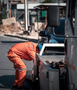 Worker Repairing A Truck